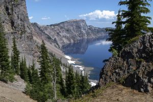 Side view of Crater Lake’s steep volcanic cliff formations
